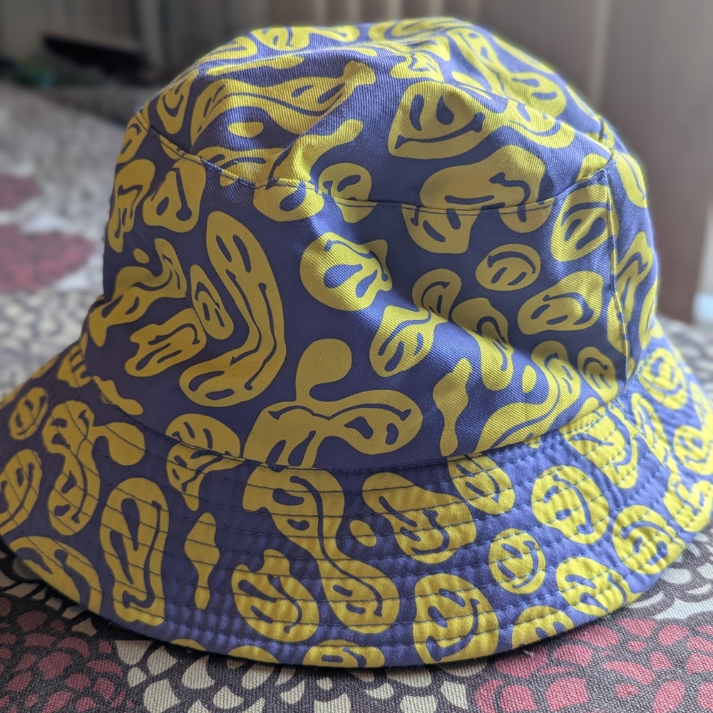 Teen Yellow and Purple Reversible Smiley Face Bucket Hat.